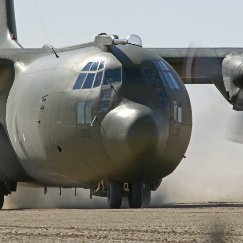 A Royal Air Force C130K Hercules prepares for takeoff from the Californian desert during 'Exercise Crown Pinnacle' in the USA.

The transport aircraft, otherwise known as a Hercules C1, is the workhorse of the RAFÕs Air Transport (AT) fleet and is based at RAF Lyneham, in Wiltshire, where it is operated by Nos 24, 30, 47 and 70 Squadrons. The fleet totals 50 aircraft and is a mixture of C1/C3 aircraft and the new C-130J aircraft, designated C4/C5.

The C1 and C3 aircraft are used primarily to carry troops, passengers or freight and are capable of carrying up to 128 passengers, or 20 tonnes of palletised freight or vehicles, for up to 2000nmls. The freight bay can accommodate a range of wheeled or tracked vehicles, or up to seven pallets of general freight. In the aeromedical evacuation role either 64 or 82 stretchers can be carried, depending on the mark of aircraft and the stretcher configuration.